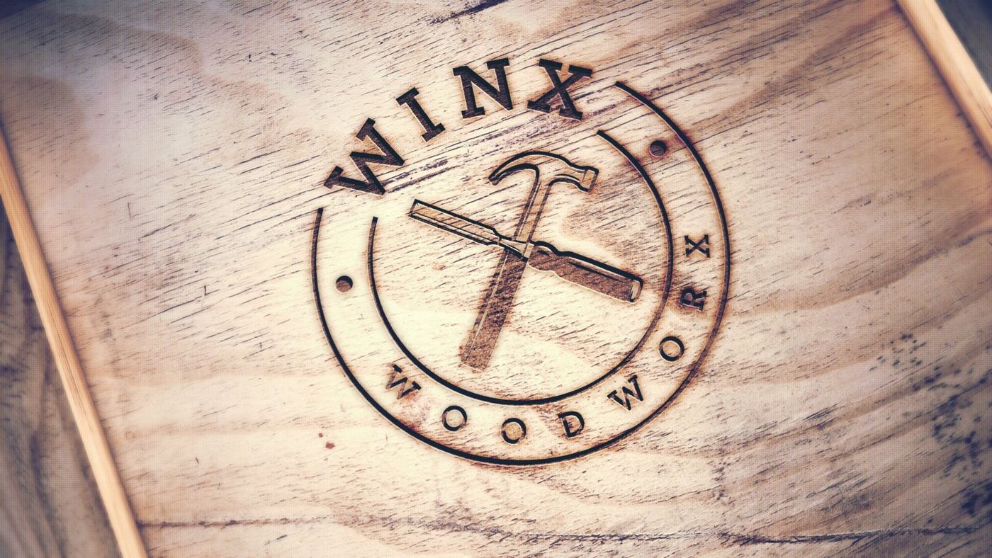 Het Winx Woodworx-brandmerk ingebrand in hout